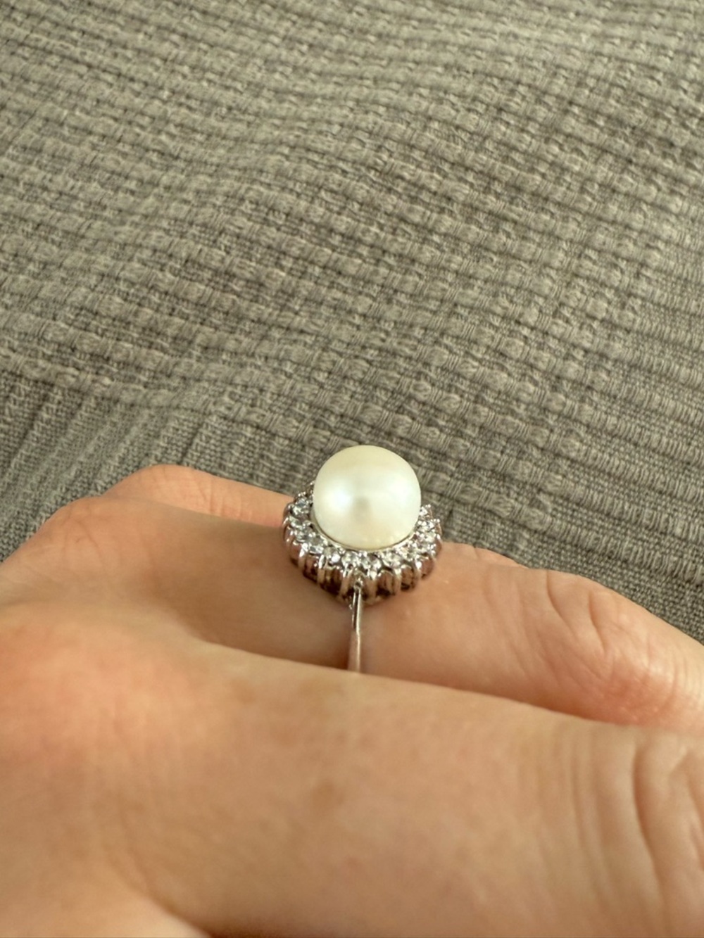 White vintage pearl ring with diamond halo